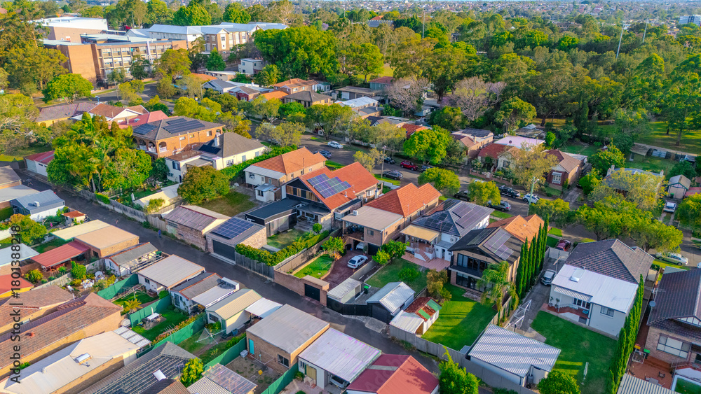 Obraz premium Aerial Panorama Drone View of a inner western Sydney Suburb of Ashbury Urban Sprawl and the terracotta roof tops streets and trees of Suburban Sydney NSW Australia