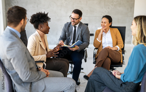 Business colleagues demonstrate teamwork, collaboration, communication, and strategy in office