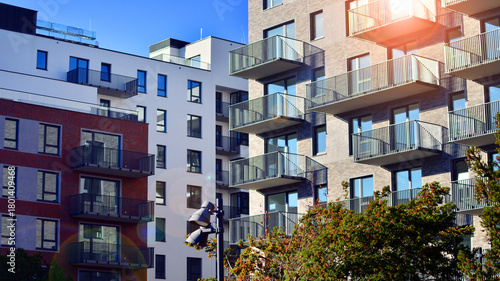 European residential architecture harmonizing with nature. Eco-friendly living in city with greens. Eco apartment building saving energy and fresh air concept. 