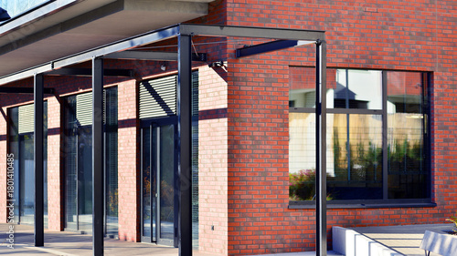 Panoramic windows of new commercial premises. Commercial property in development standard for rent. Modern housing estate.