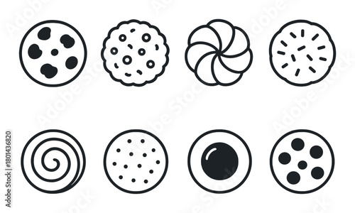 Assorted cookie shapes on dark background: round, swirl, and more