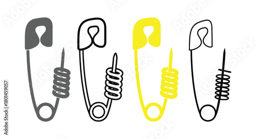 Simple black and white safety pins lined up on white backdrop