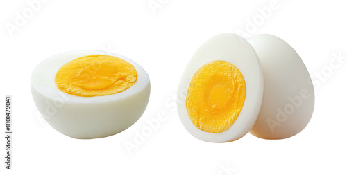 Two whole eggs and one halved hard-boiled egg with bright yellow yolks