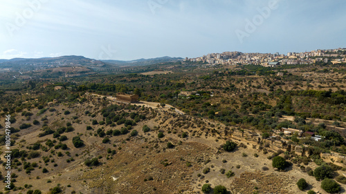 Aerial view of the archaeological area of ​​the Valley of the Temples, located in Sicily, Italy. In background is the city of Agrigento. It's an example of ancient Greek architecture of Magna Graecia.
