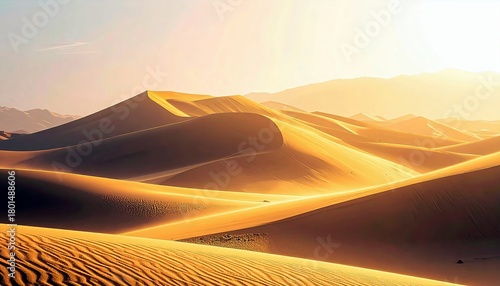 Fototapeta Naklejka Na Ścianę i Meble -  Vast desert landscape featuring rolling sand dunes illuminated by the warm glow of the sun, creating dramatic shadows and highlights.