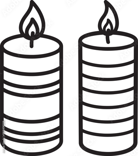 Two lit candles silhouette