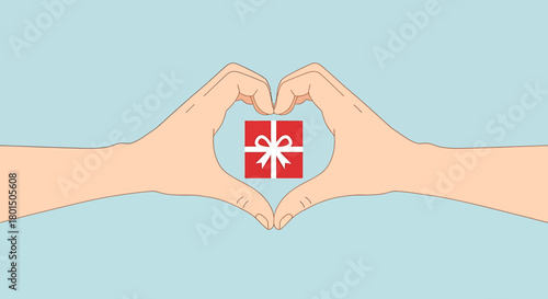 Human hands forming a heart shape holding a red gift box, symbolizing love and giving.