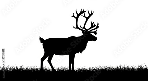 Majestic reindeer silhouette standing gracefully in a field of grass, isolated on, capturing the essence of natures beauty and wildlife charm