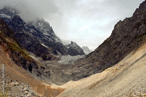 Chalaadi Glacier, ice, glacial flour, moraine, and snow in the Caucasus Mountains. Mestia, Svaneti, Georgia.