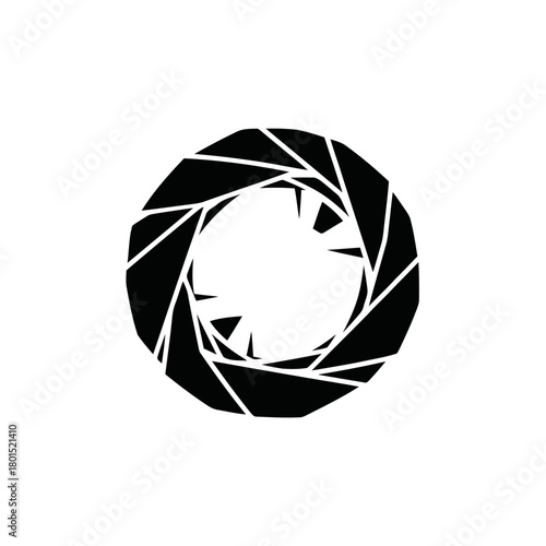 Abstract geometric aperture or iris symbol in black and white.