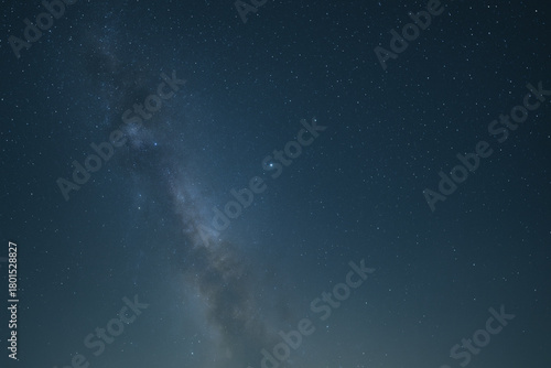 A vibrant depiction of a galactic black hole with swirling colors