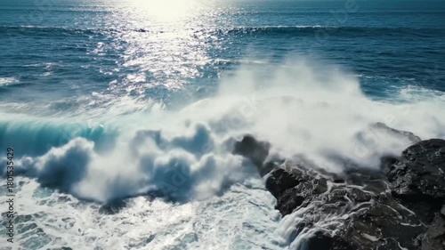 Powerful Ocean Wave Crashing Against Rugged Coastal Rocks Dynamic Sea Spray Energy and Strength Nature Background