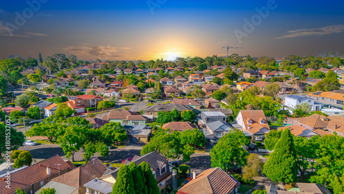 Aerial Panorama Drone View of a inner western Sydney Suburb of Ashbury Urban Sprawl and the terracotta roof tops streets and trees of Suburban Sydney  NSW Australia