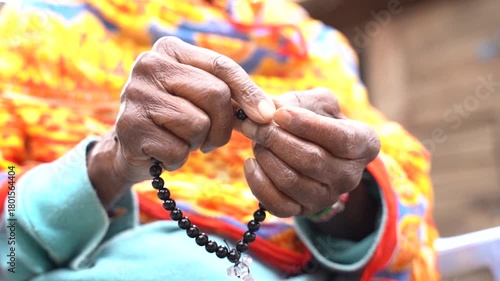 Muslim Women Praying Salat And Counting Beads On Eid Al-Fitr.