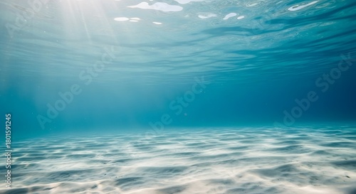 Fototapeta Naklejka Na Ścianę i Meble -  Tranquil underwater scene with sunlight and sand