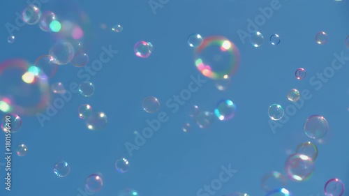 A whimsical scene where colorful soap bubbles float and drift randomly through a clear