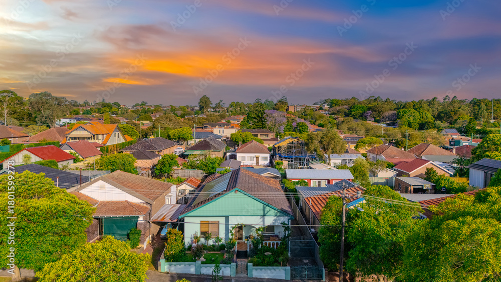 Obraz premium Aerial Panorama Drone View of a inner western Sydney Suburb of Ashbury Urban Sprawl and the terracotta roof tops streets and trees of Suburban Sydney NSW Australia