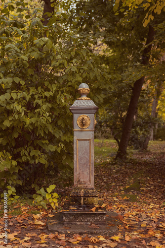 Close-up of an ornate, rusted antique water fountain