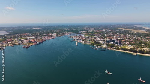 Wallpaper Mural Pull-up aerial shot of Labuan Island, Malaysia, showing Victoria City skyline, coastline, and ships anchored offshore in calm blue waters. Torontodigital.ca