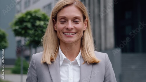 Female portrait happy smiling satisfied caucasian business woman in city looking at camera smile toothy with white healthy teeth successful middle-aged businesswoman executive employer corporate agent