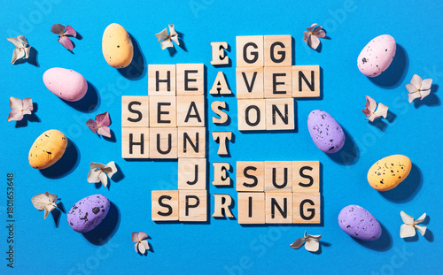 Crossword puzzle with wooden blocks and easter theme