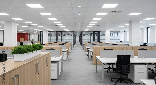 Spacious modern office interior with rows of desks and chairs, illuminated by bright ceiling lights, creating a clean and professional workspace environment