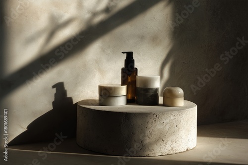 Decorative Display of Minimalist Skincare Products on a Round Stone Pedestal