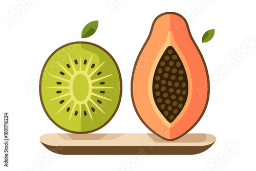 Cross section of kiwi and papaya fruits displayed on a serving plate
