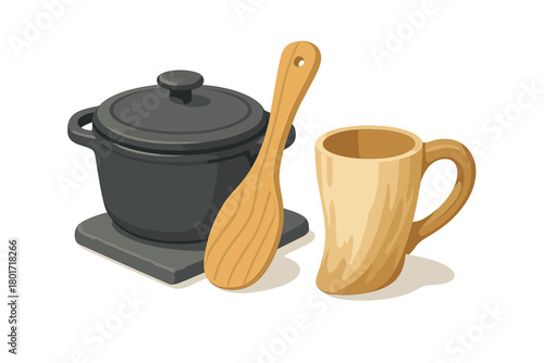 Black cast iron cooking pot, wooden spoon, and natural wood mug isolated