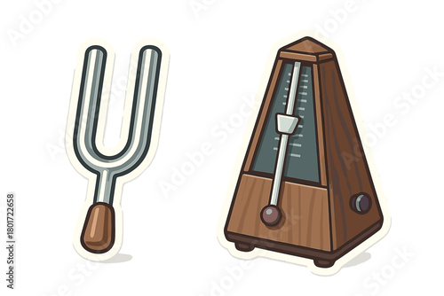 Tuning fork and wooden metronome isolated on a white background