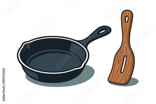 Cast iron skillet and wooden spatula cooking utensils set