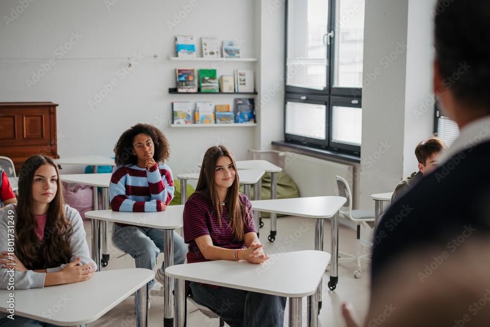 Obraz premium Confident teen student standing in modern classroom.