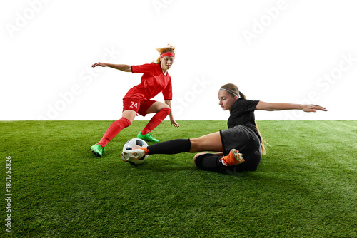 Schilderij op canvas Female football players competing for ball in intense sliding tackle moment