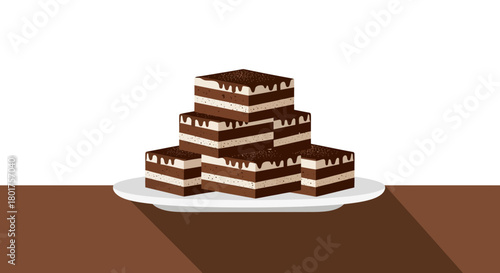 Delicious Chocolate Layer Cake Squares Stacked on a White Plate on Brown Table