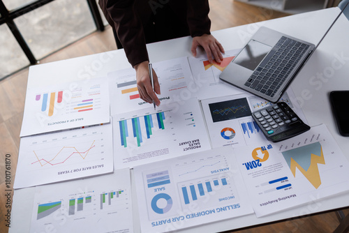 Fotografie Hand of Many charts and graphs