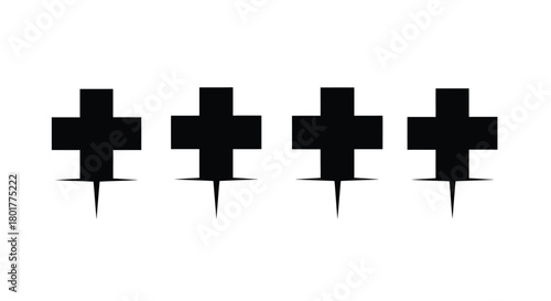 Four black crosses with pins in a row