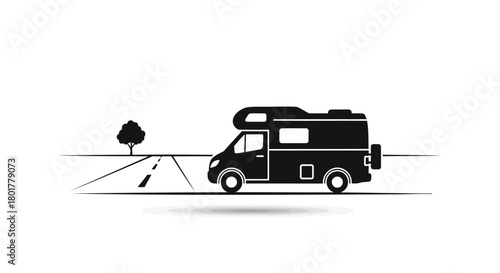 Silhouette of a modern camper van driving on a road with a single tree in the background