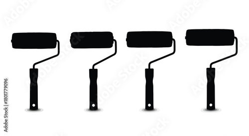 Four black paint rollers for painting concept