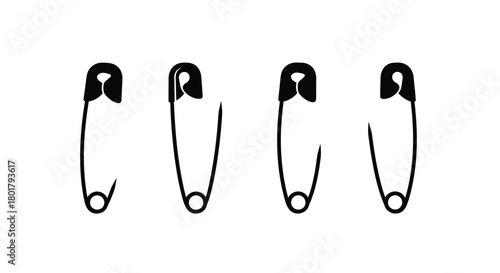 Four safety pins in different states