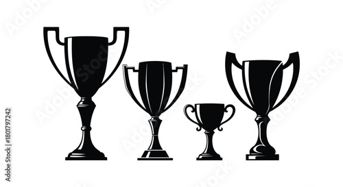 Four trophies of different sizes are displayed