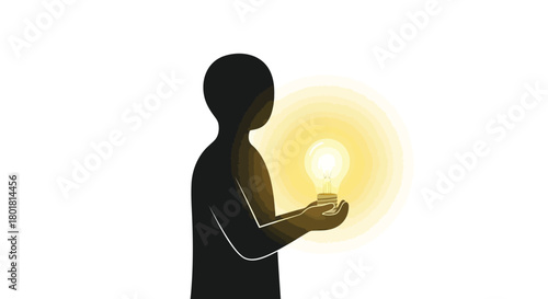 Silhouette of a person holding a glowing light bulb representing a new idea or innovation