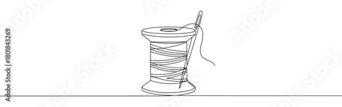 Continuous one line drawing of a spool of thread with a needle. Concept of sewing, tailoring, and crafting