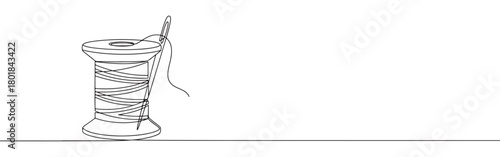 Continuous one line drawing of a spool of thread with a needle. Concept of sewing, tailoring, and crafting