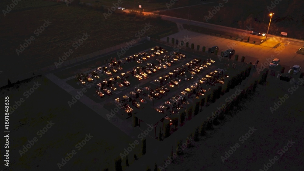 Fototapeta premium Cemetery illuminated with candles on All Saints Day in Poland