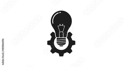 Black silhouette of a light bulb on top of a gear representing innovation and mechanical ideas