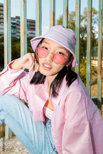 Asian girl in casual Gen Z fashion with sunglasses