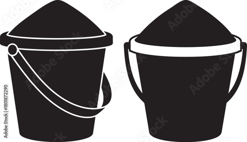 Two sand buckets filled with sand silhouette