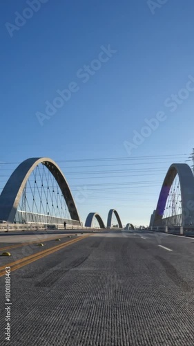 Early morning driving view crossing the new 6th Street Bridge near downtown Los Angeles in Southern California.  Vertical view.
