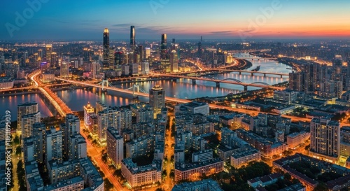 Fototapeta Naklejka Na Ścianę i Meble -  A bustling city skyline at dusk with illuminated buildings and bridges, featuring a mix of modern and traditional architecture.