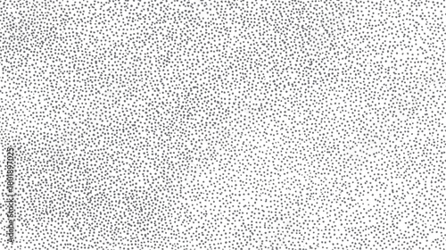 A dense pattern of small irregular grey dots scattered across a clean white background creating a textured effect